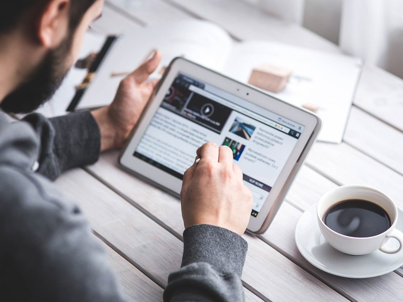 Person Working on Tablet Person Working on Tablet